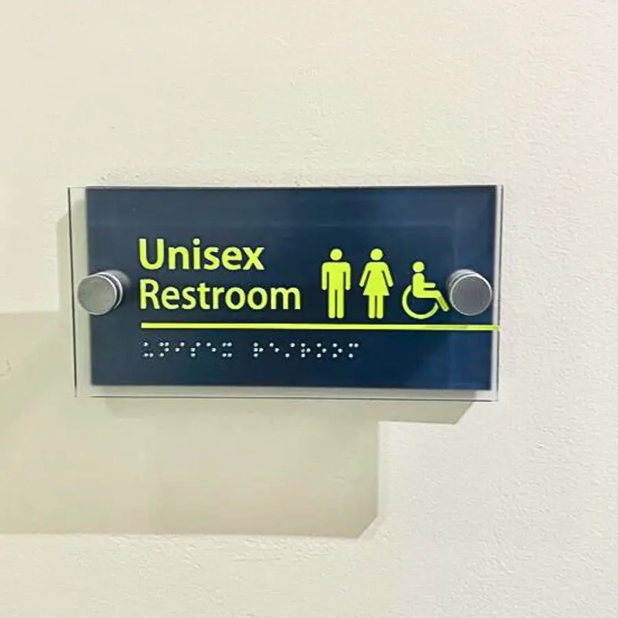 ADA-compliant restroom sign with braille