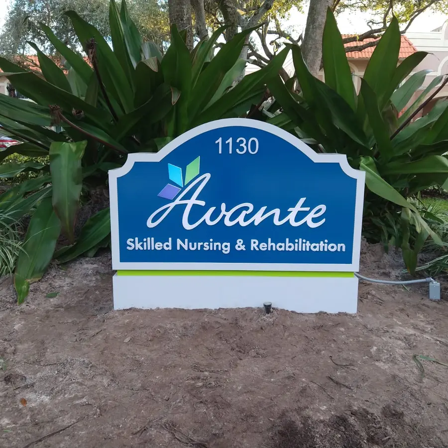 Illuminated monument sign with stone base at a skilled nursing facility