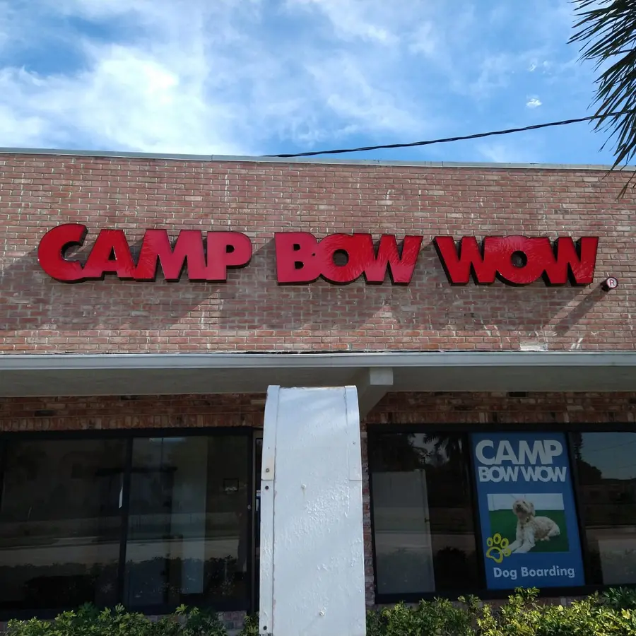 Front-lit red channel letters on a brick facade