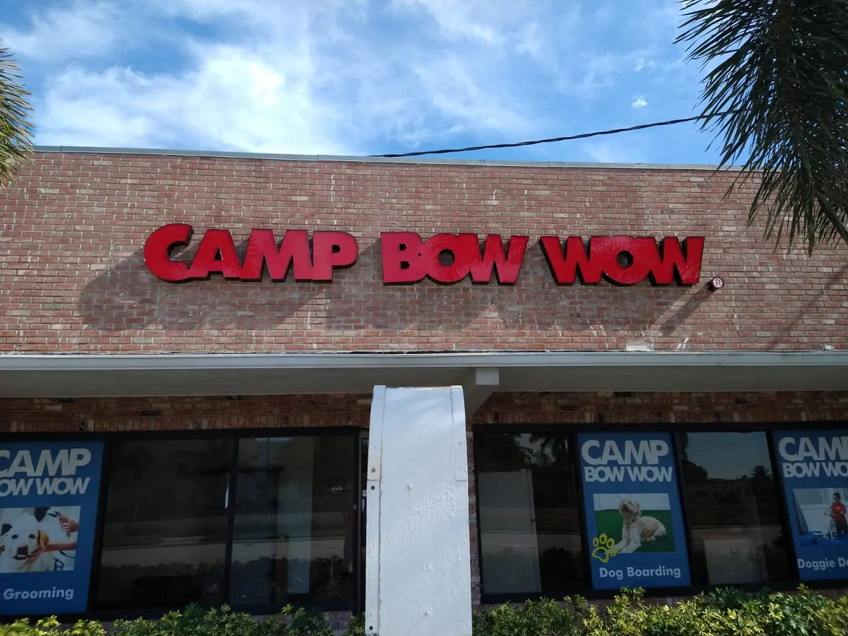 Front-lit red channel letters on a brick facade