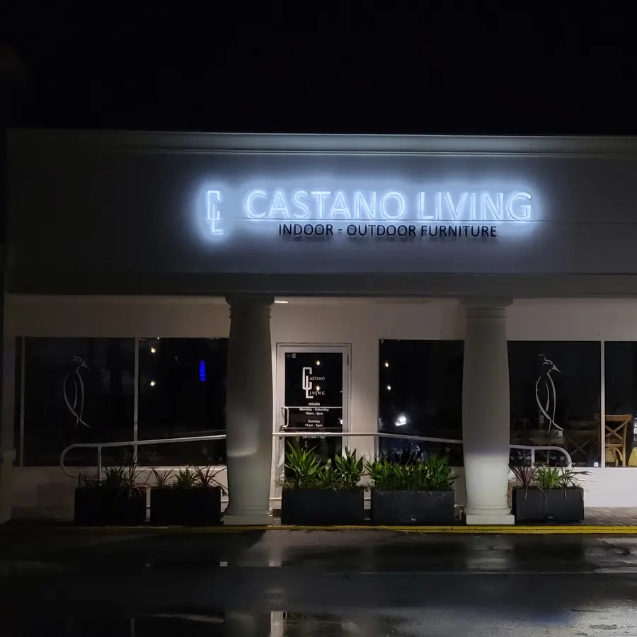 Castano Living storefront at night with illuminated channel letters