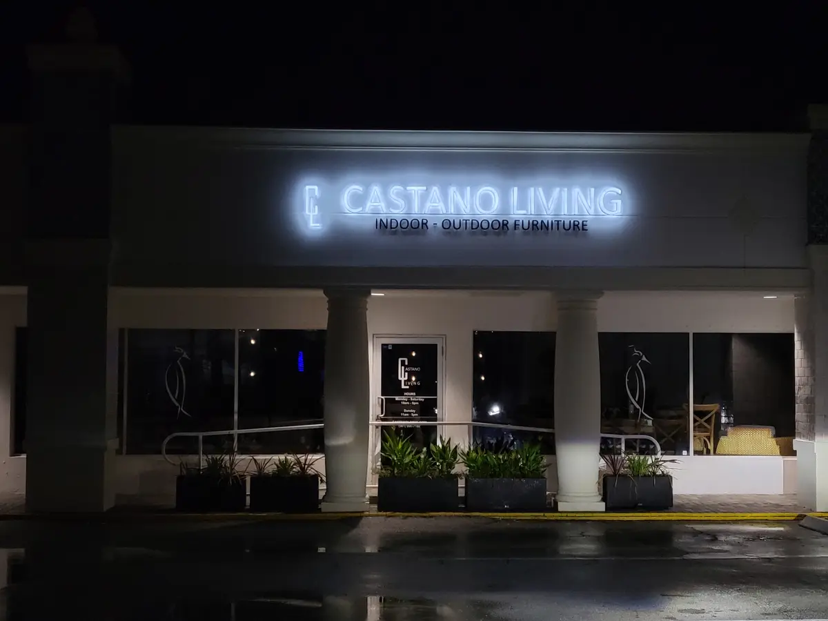 Castano Living storefront at night with illuminated channel letters