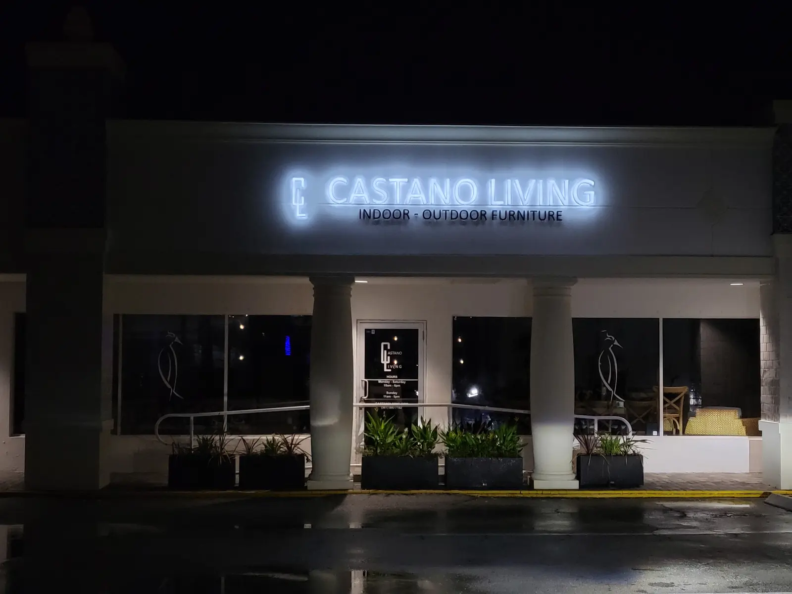 Castano Living storefront at night with illuminated channel letters