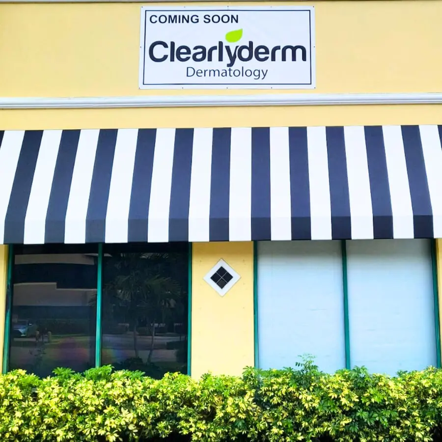Clearlyderm coming soon banner over a striped awning