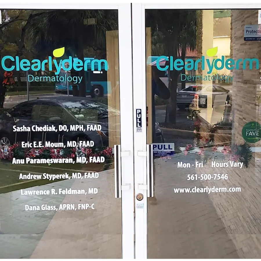 Clearlyderm door vinyl with provider names and hours