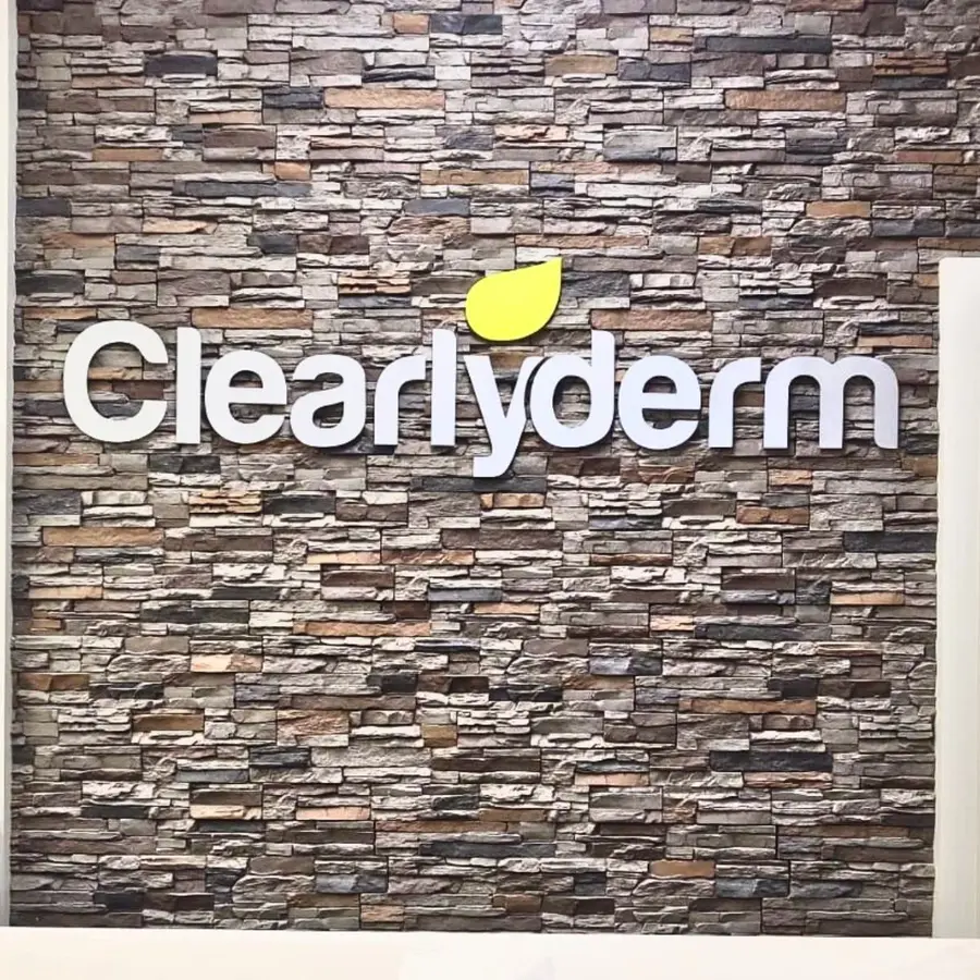 Clearlyderm letters on a stone wall