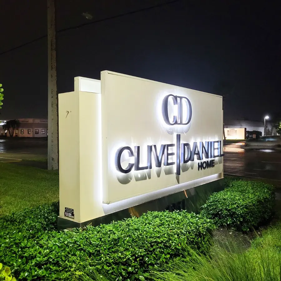 Clive Daniel Home illuminated monument sign at night