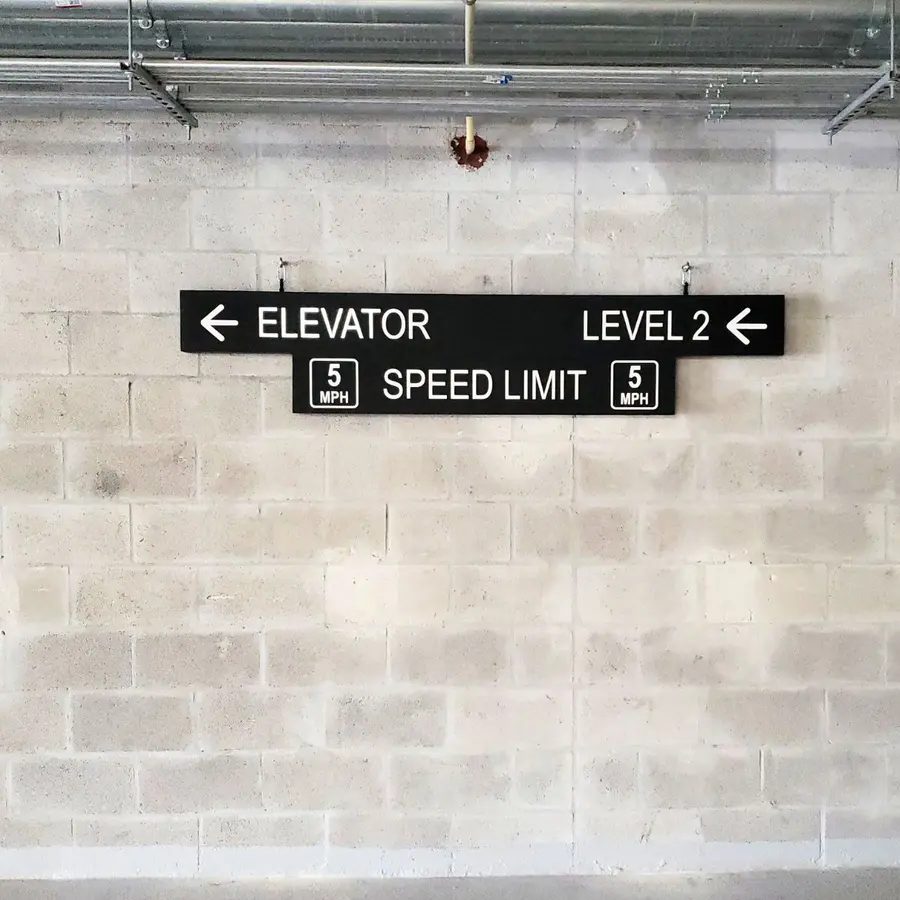 Parking garage signs: Elevator, Level 2, Speed Limit