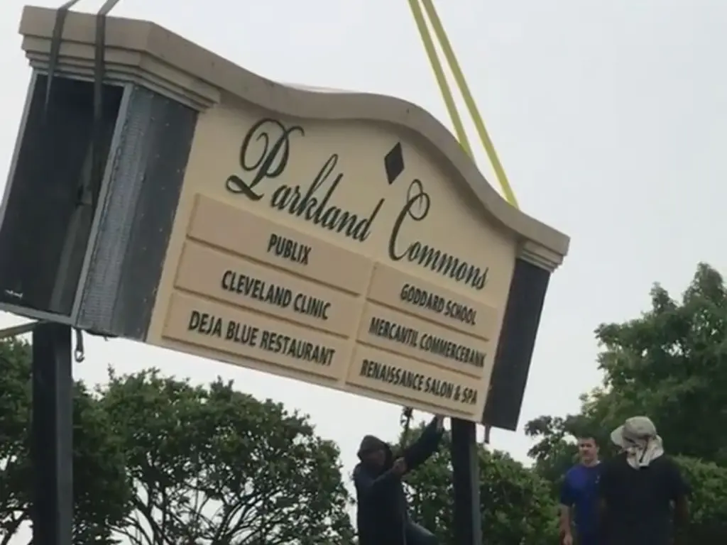 Parkland Commons pylon sign being lifted by crane