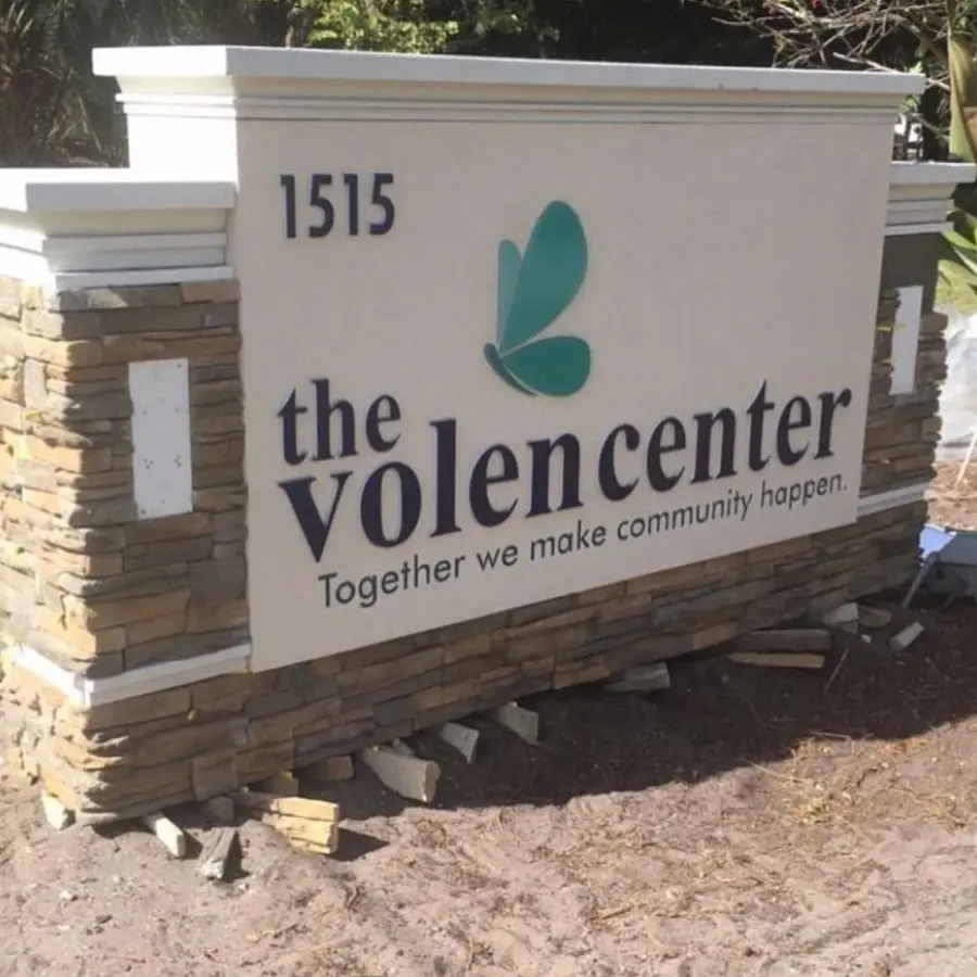 Stone monument sign for The Volen Center under installation